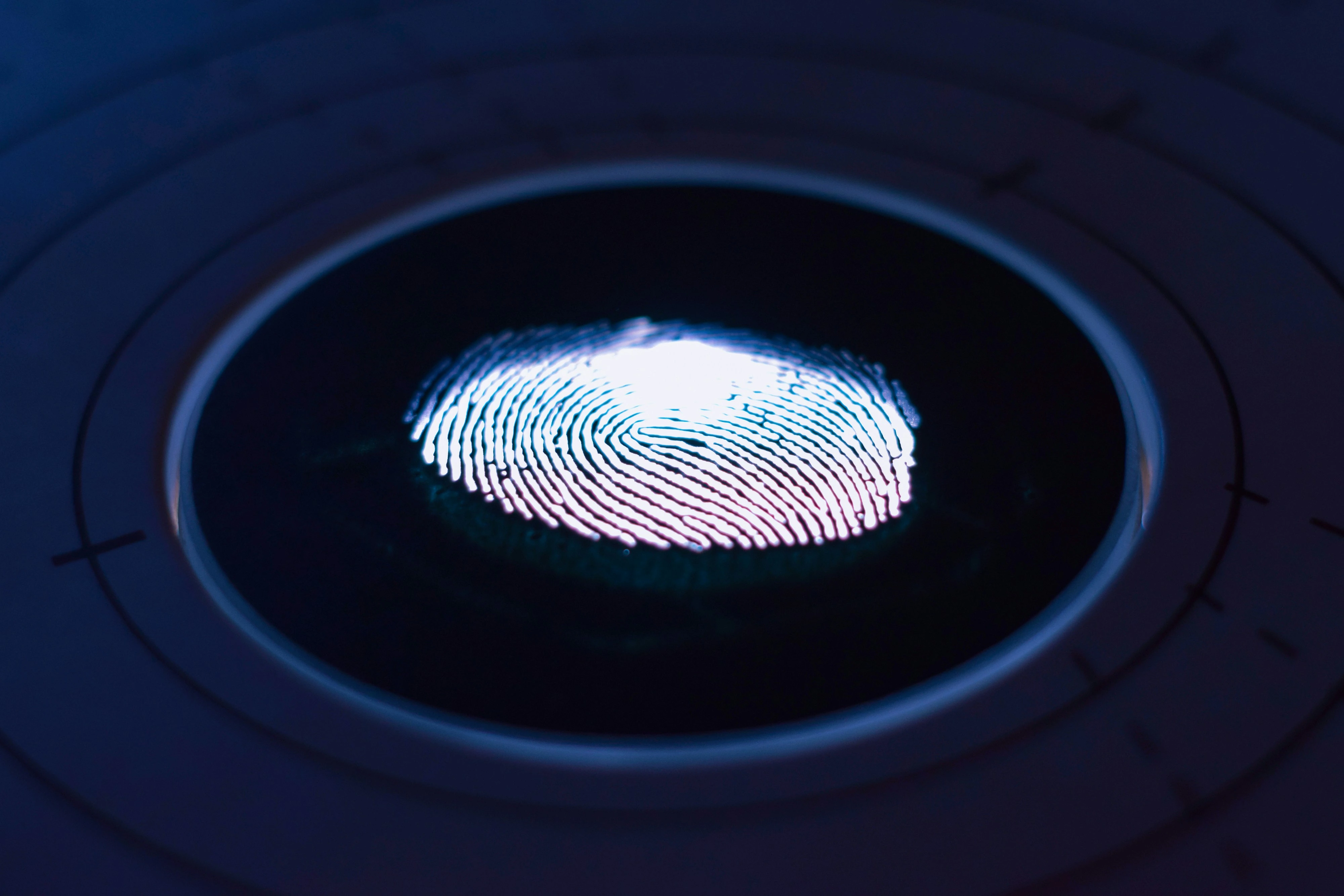 Glowing fingerprint on glass